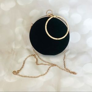 Black and gold circle clutch bag